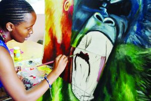 Mpho Sephelane working on one of her paintings