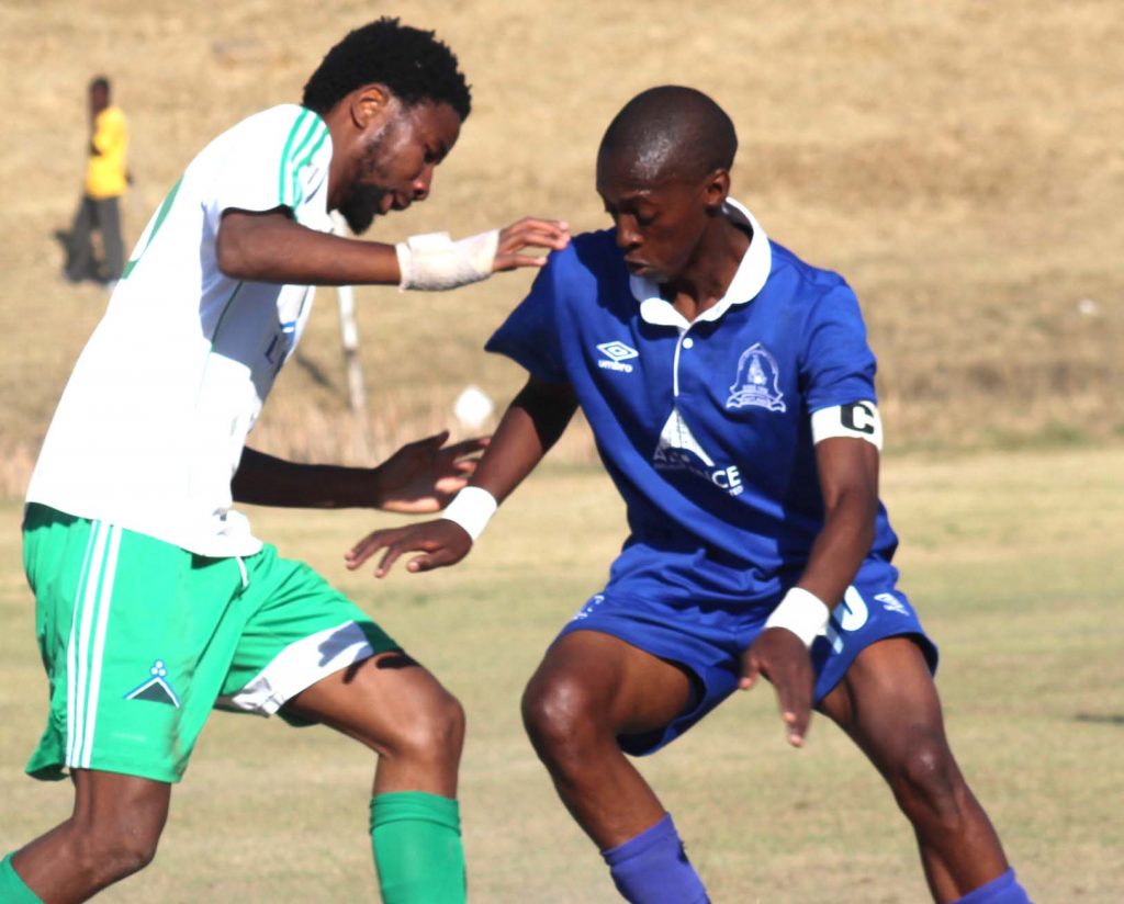 Linare striker Ts'iu Moroosi,left, tussle for the ball with Matlama midfielder Phafa Ts'osane last season during VCL Premier Leaque tie