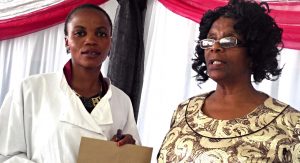 Headmistress, Mamoshe Makumane handing one  graduates her certificate during the graduation  held at Sefika Hall yesterday 