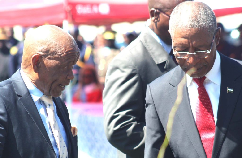 Outgoing Prime Min Thom Thabane, left, chats with the incoming PM Pakalitha Mosisili after hading over power on at Setsoto Stadium on  Tuesday 