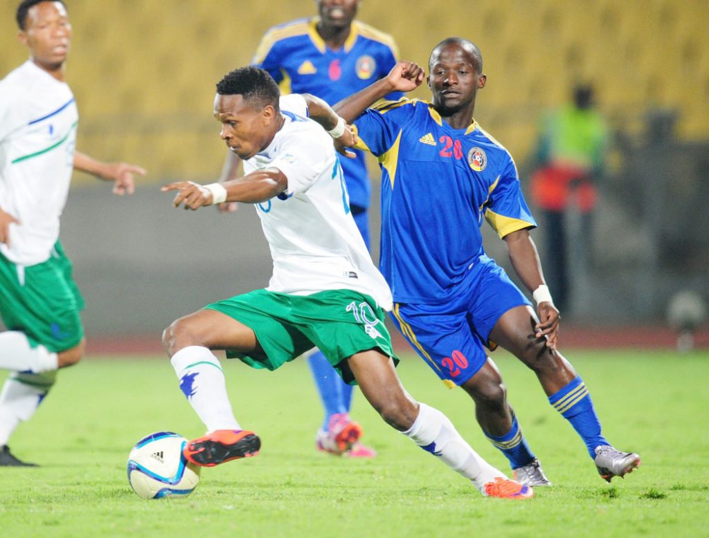 Mabuti Potloane of Lesotho challenged by Mxolisi Lukhele  of Swaziland during the 2015 Cosafa Cup match between Lesotho and Swaziland at the Royal Bafokeng Stadium, Rustenburg