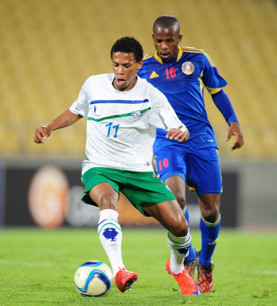 Tsoanelo Koetle of Lesotho challenged by Zweli Nxumalo of Swaziland during the 2015 Cosafa Cup match between Lesotho and Swaziland at the Royal Bafokeng Stadium, Rustenburg