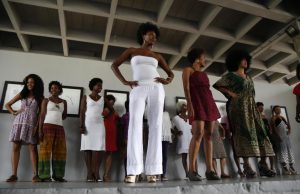 Contestants display their hairdo on stage during an Afro hair contest in Havana, Saturday, June 13, 2015. Susana Delahante, an internationally known 30-year-old Havana artist, invited black and mixed-race women to compete in three hair categories, natural, braided and dreadlocked. (AP Photo/Desmond Boylan)