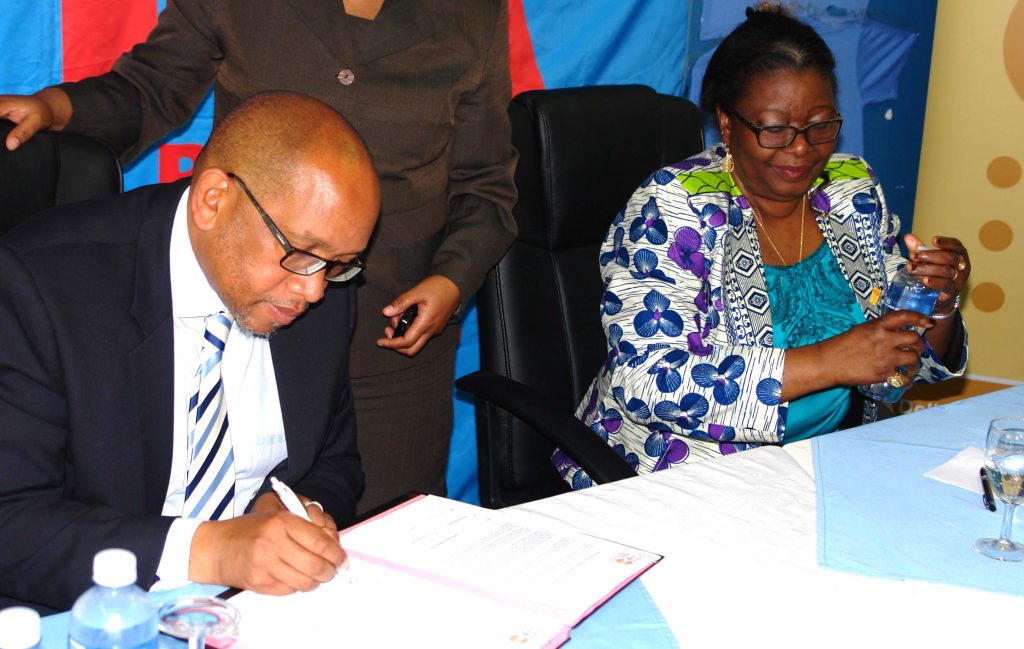 LPPA Goodwill Ambassador Chief Seeiso Bereng Seeiso signs agreement ahead of UNFPA country representative Therese Zeta Kobeane