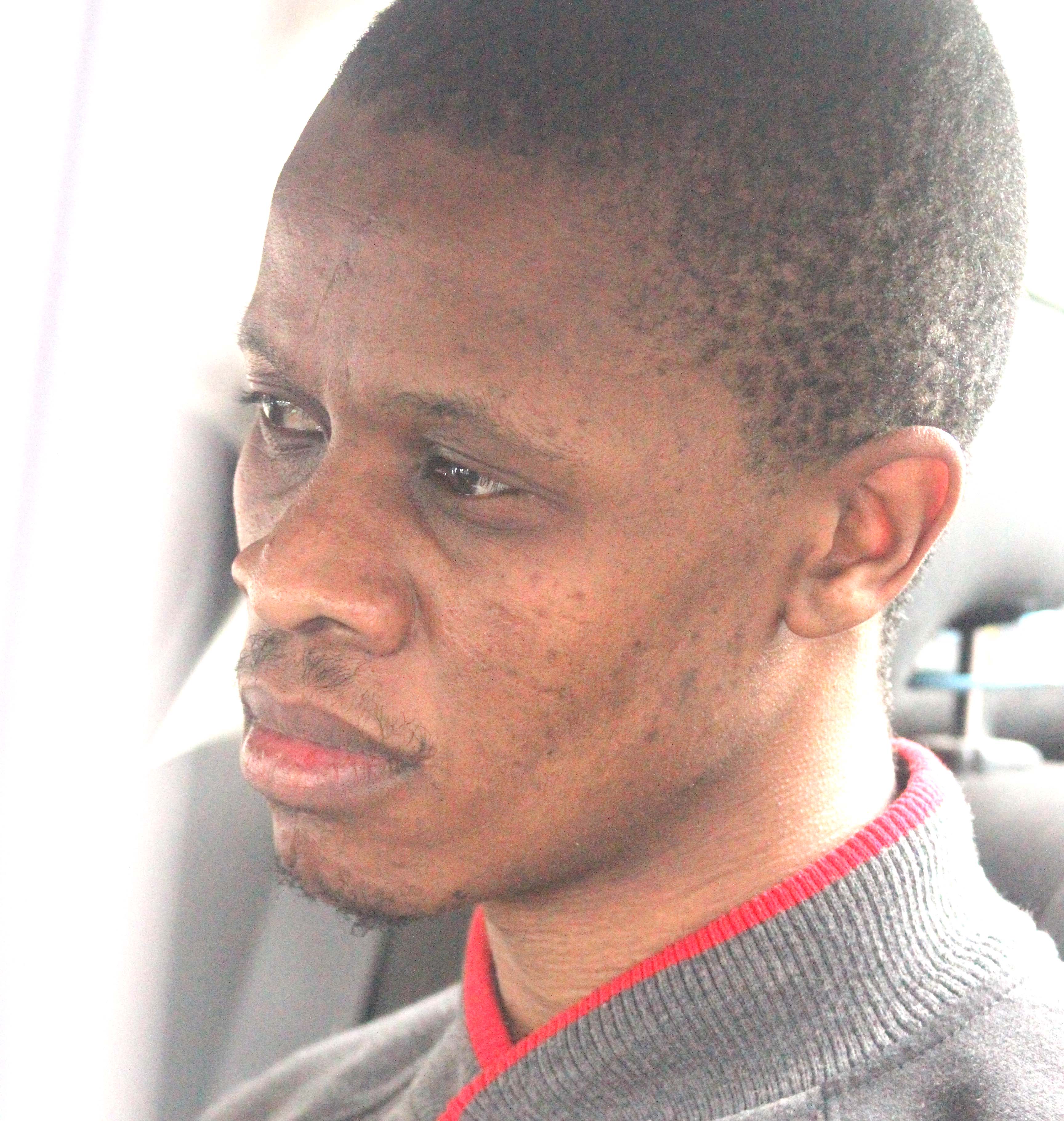Double ritual murder suspect Lehlohonolo Scott was extradited from South Africa midmorning yesterday amid tight security - Scott