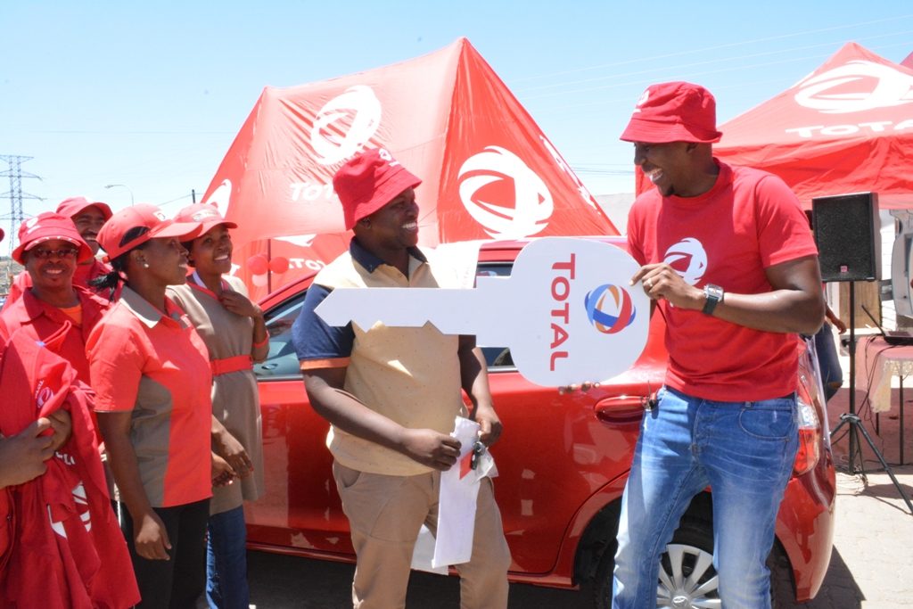 TL Territory Manager Letele (right) presents the Toyota Etios to Qhoko Masokela in Masianokeng on Saturday (3)