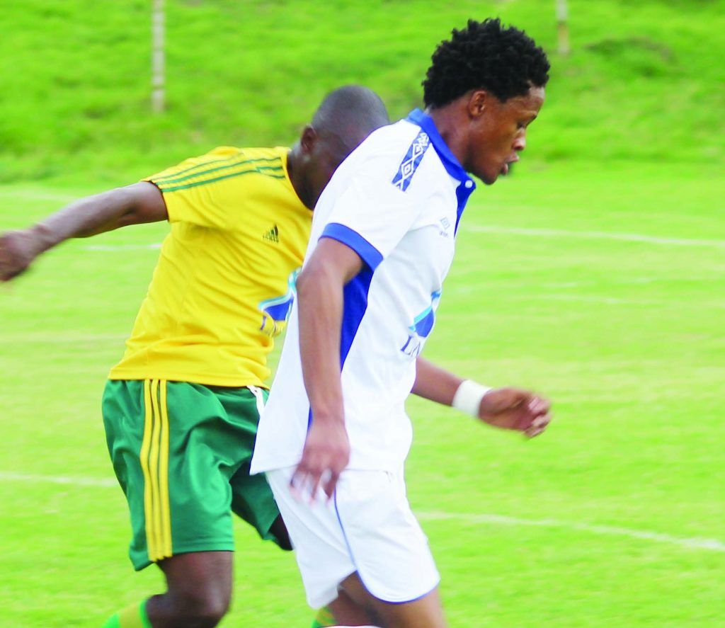 Matlama striker Motebang Sera (in front) closely wathced by LDf defender Koporale Motanyane in LNIG Top8 quarterfinal played at LCS yesterday (1)