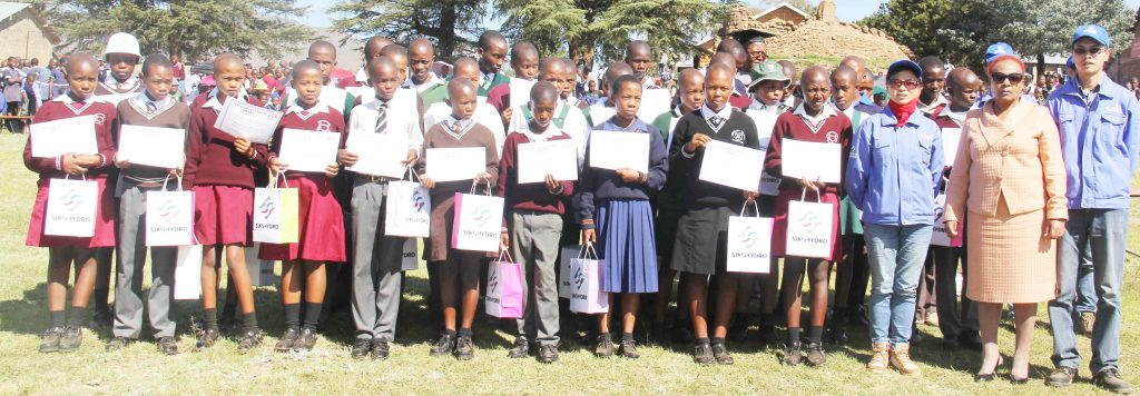 students who recieved prizes together with sinohydro managers and education officers