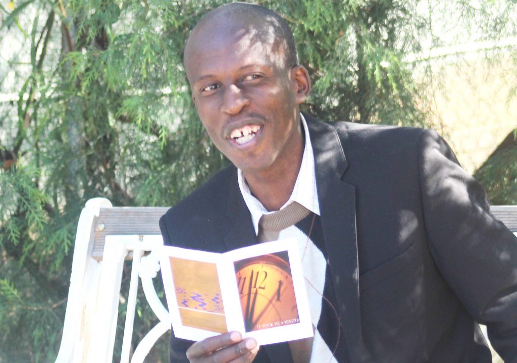 Author Bantu Lerotholi displaying some of the poems he has worked on