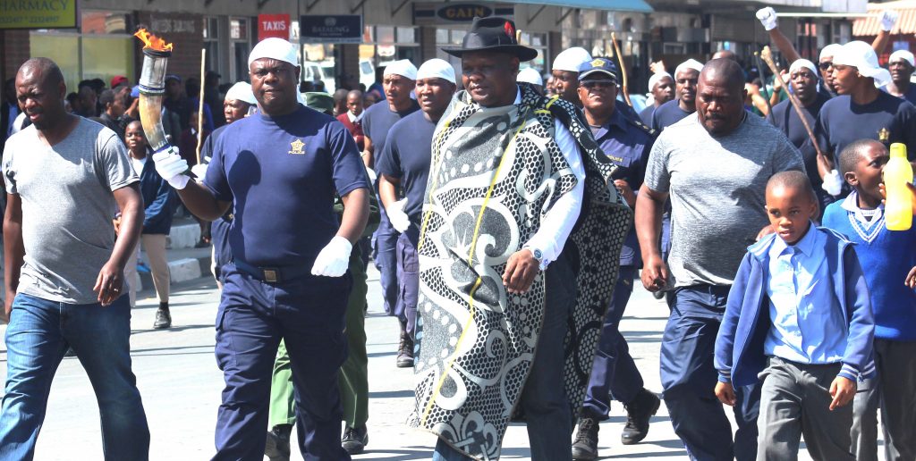 District Commissioner of Maseru Urban Police Senior Superintendent Motlatsi Mapola hold peace lanten during arrival in Maseru on Monday